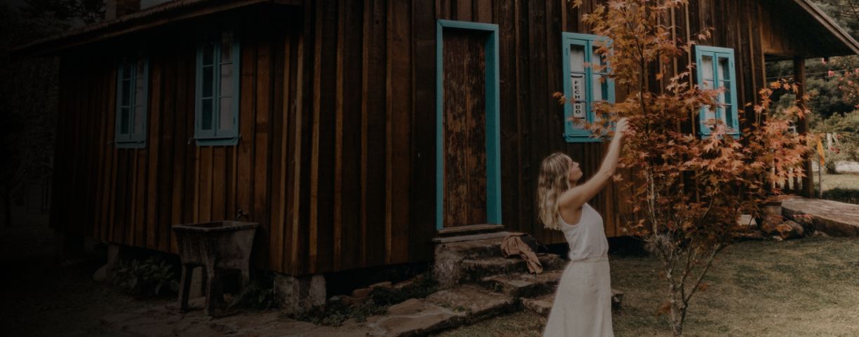 Woman in white dress at holiday house